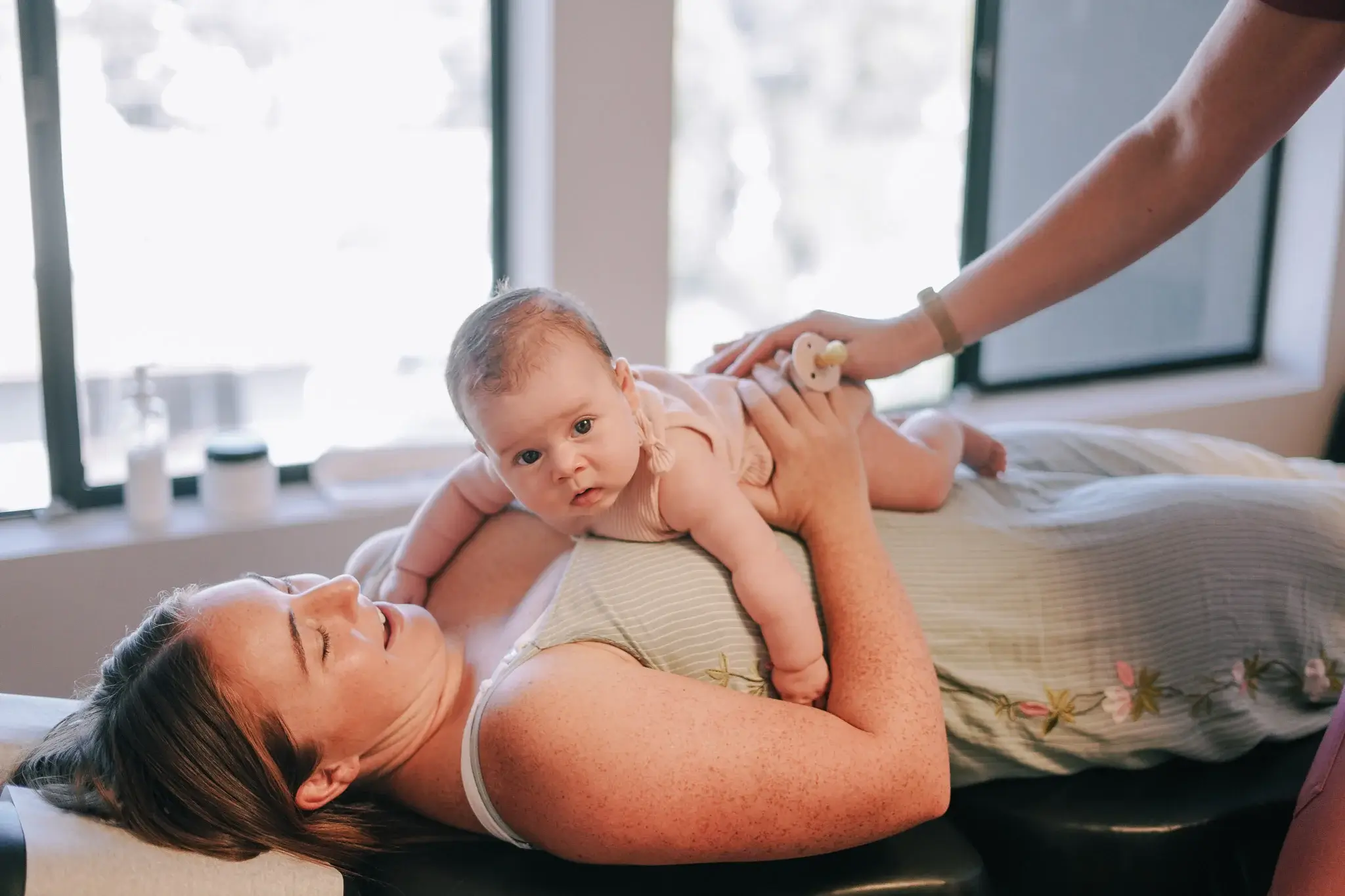 A gentle prenatal adjustment on pregnant patient of Chiropractor in Mission Valley